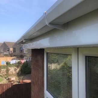 Clean white gutters after professional cleaning service